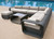 Pembroke Sectional with Ottoman and Coffee Table Patio Seating Set Room Scene